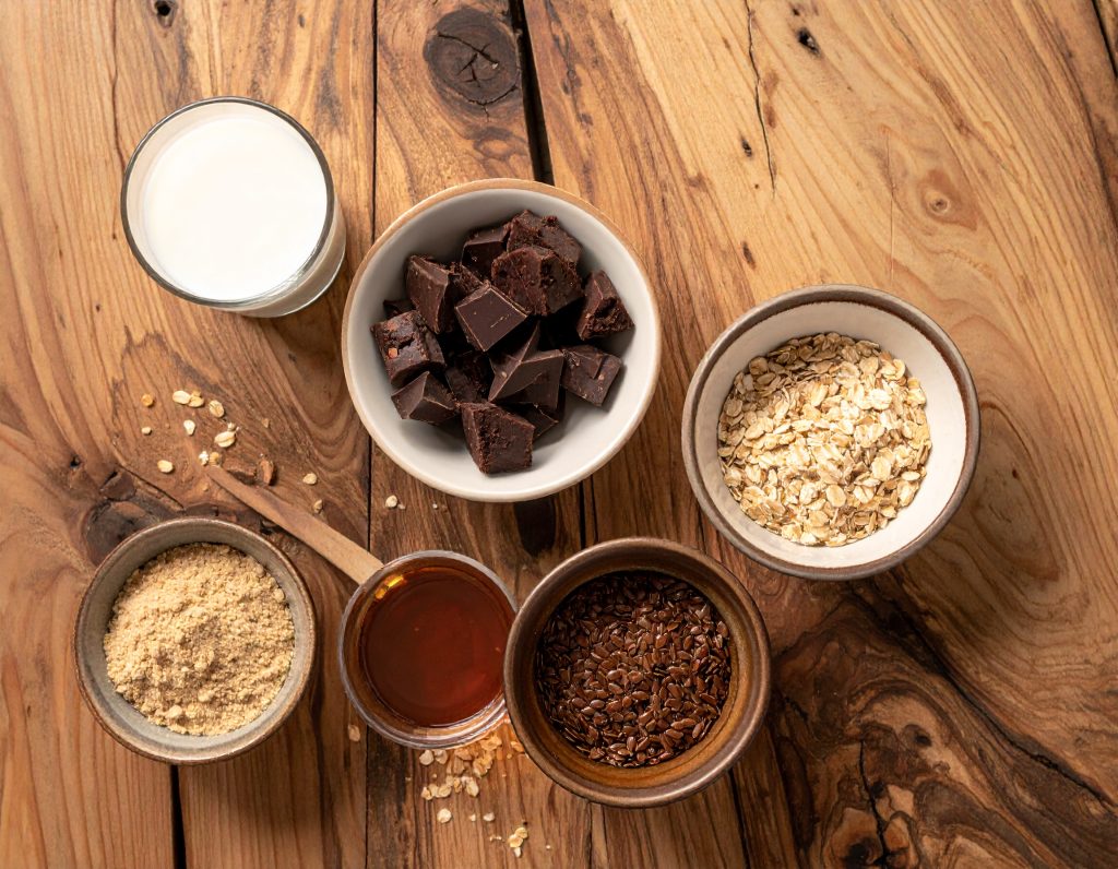 Zutaten für Schoko-Energy-Balls mit Haferflocken, Schokolade und Nussmus